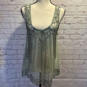 Medium sheer tank with bead and sequin detailing.